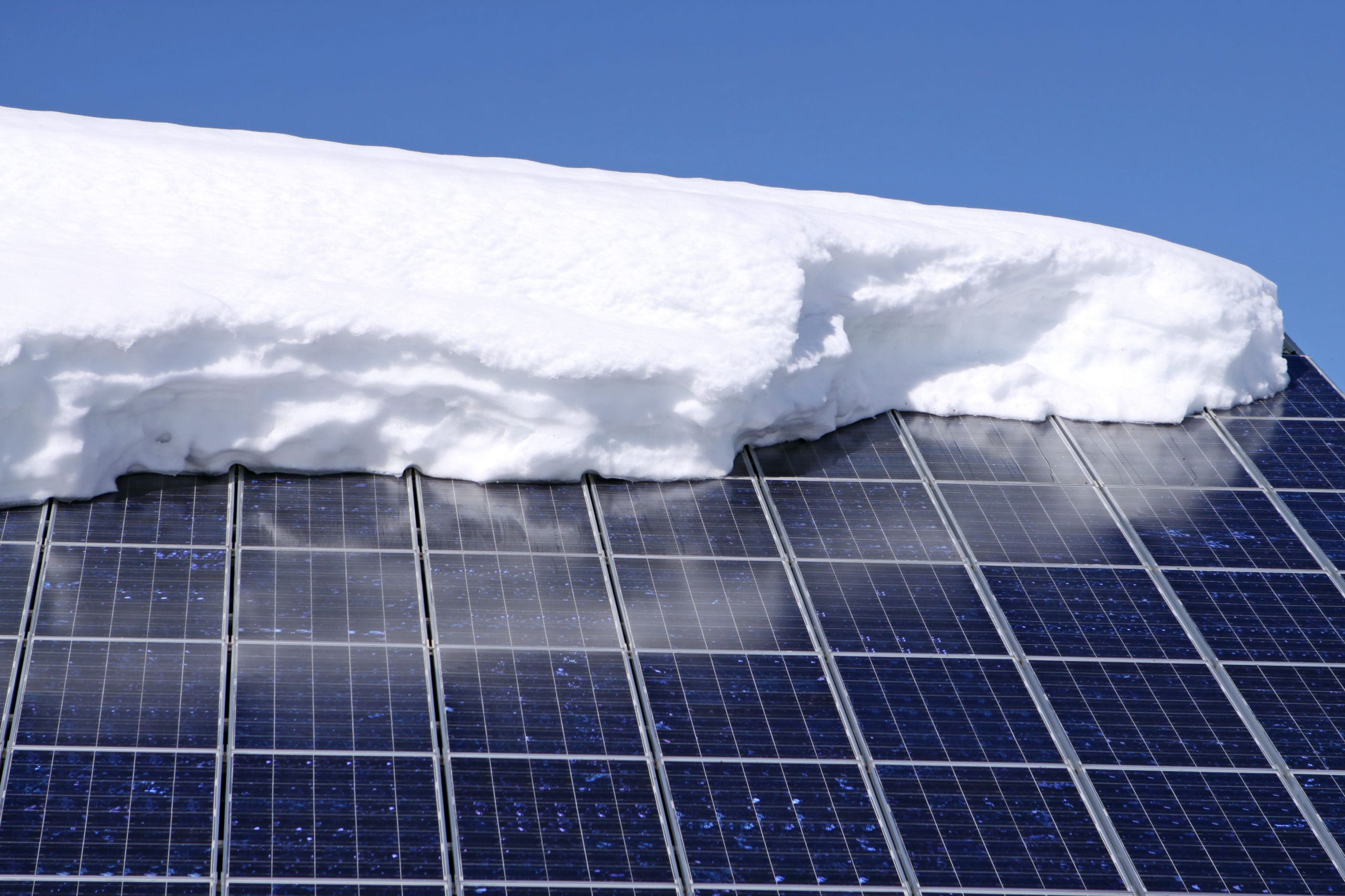 solar panels with snow
